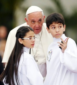Pope Francis and children in Paraguay recently. Courtesy of NY Times.